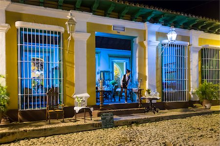 empty street - Waitress Looking Out Door of Restaurant Museo at Night, Trinidad, Cuba Photographie de stock - Rights-Managed, Code: 700-06465992