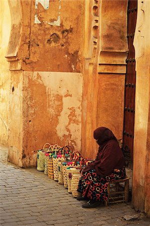 Woman Sitting on Stool with Line of Bags Beside Her in the Old Town, Medina, Marrakesh, Morocco, Africa Stock Photo - Rights-Managed, Code: 700-06505732