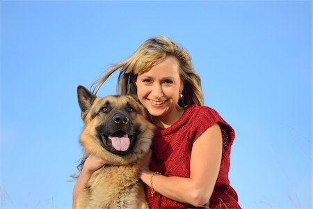 dog look up person - Portrait of Woman Wearing Red Sweater with German Shepherd Dog Stock Photo - Rights-Managed, Code: 700-06531486