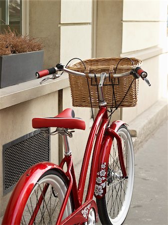 Close-up of red, classic, road bicycle with wicker basket attached to handlebars, Paris, France Stock Photo - Rights-Managed, Code: 700-06531924