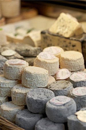 shop nobody - Fresh wedges and rounds of French goat cheese in artisan cheese shop, La Fromagerie, Paris, France Stock Photo - Rights-Managed, Code: 700-06531956