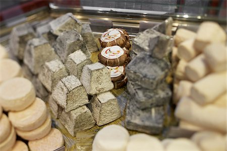simsearch:700-06531957,k - Fresh wedges and rounds of French goat cheese in artisan cheese shop, La Fromagerie, Paris, France Stock Photo - Rights-Managed, Code: 700-06531952