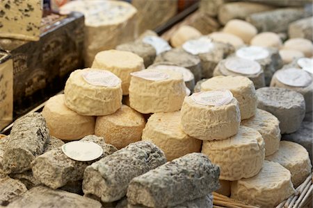 food product - Fresh wedges and rounds of French goat cheese in artisan cheese shop, La Fromagerie, Paris, France Stock Photo - Rights-Managed, Code: 700-06531960