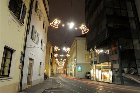 deserted street at night - Bell-Shaped Lights Strung Across Street with Streaking Taillights at Night, Sackstrasse, Graz, Styria, Austria Stock Photo - Rights-Managed, Code: 700-06543478