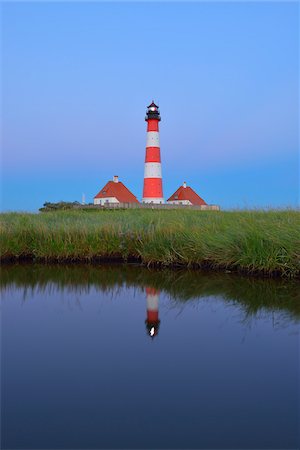 reflejo (espejo) - Westerhever Lighthouse Reflected in Pond at Dusk, Westerhever, Tating, Schleswig-Holstein, Germany Foto de stock - Con derechos protegidos, Código: 700-06576218