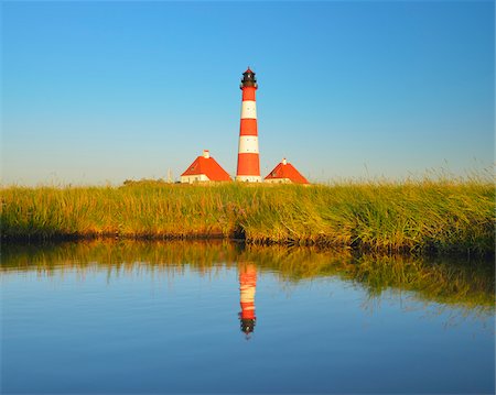 Westerhever Lighthouse Reflected in Pond at Dusk, Westerhever, Tating, Schleswig-Holstein, Germany Stock Photo - Rights-Managed, Code: 700-06576213