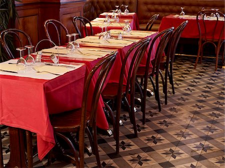 eating restaurant not eye contact - tables set with red tablecloths, wine glasses and cutlery in restaurant, Paris, France Stock Photo - Rights-Managed, Code: 700-06626975