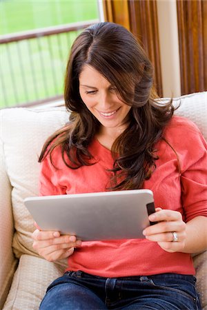 Woman Holding iPad at Home Stock Photo - Rights-Managed, Code: 700-06645603