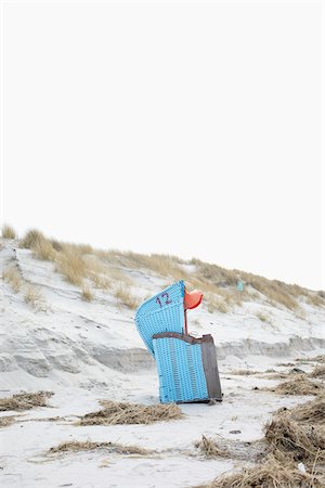 deck chairs - Beach Chair on Deserted Beach in Winter, North Sea, Norddorf, Amrum Island, Nordfriesland, Germany Stock Photo - Rights-Managed, Code: 700-06679324