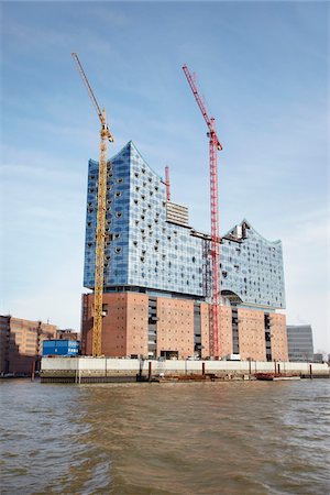 en construcción - Elbe Philharmonic Hall with Construction Cranes on Elbe River, HafenCity, Hamburg, Germany Photographie de stock - Rights-Managed, Code: 700-06679344