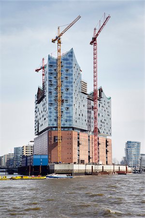 flat - Elbe Philharmonic Hall with Construction Cranes on Elbe River, HafenCity, Hamburg, Germany Stock Photo - Rights-Managed, Code: 700-06679345