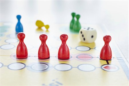 close-up of ludo board game with colored playing pieces and dice Stock Photo - Rights-Managed, Code: 700-06679358