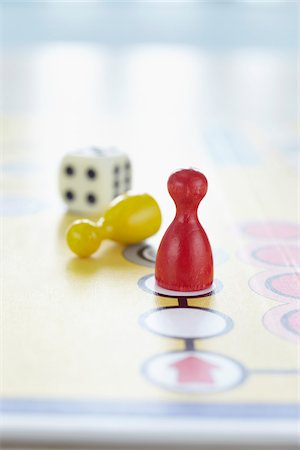 close-up of ludo board game with colored playing pieces and dice Stock Photo - Rights-Managed, Code: 700-06679359