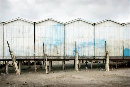 Wooden Beach Huts and Fence on Beach in Winter, Ostia Lido, Rome, Italy Photographie de stock - Rights-Managed, Code: 700-06685204