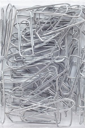 close-up of jumble of silver paperclips Fotografie stock - Rights-Managed, Codice: 700-06701943