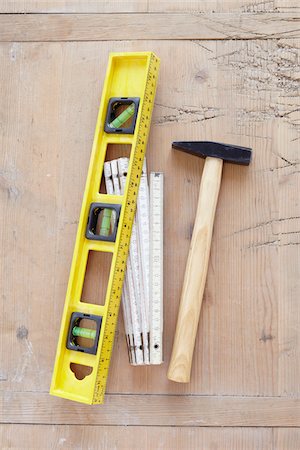 still life of tools, hammer, bubble level, and folding meter stick Stockbilder - Lizenzpflichtiges, Bildnummer: 700-06714097