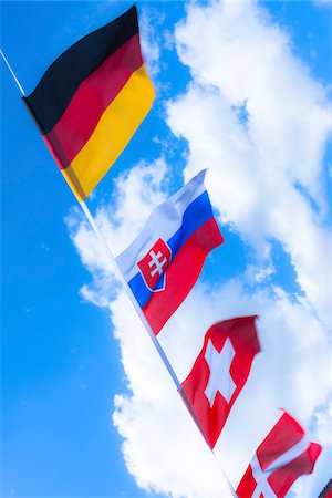 europe flag - Swiss, German, Danish and Slovakian flags against blue summer sky Photographie de stock - Rights-Managed, Code: 700-06752249