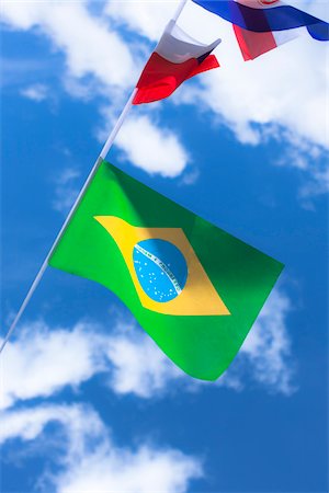 Brazilian and French flags against blue summer sky Stockbilder - Lizenzpflichtiges, Bildnummer: 700-06752254