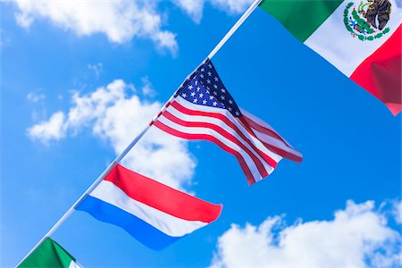 diagonal lines in photography - Mexican, American, and Dutch flags against blue summer sky Stock Photo - Rights-Managed, Code: 700-06752250