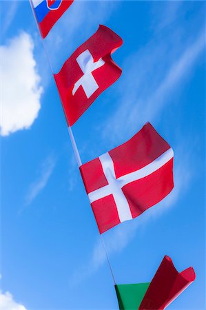 politique (relatif à la politique) - Slovakian, Swiss, and Danish flags against blue summer sky Photographie de stock - Rights-Managed, Code: 700-06752252