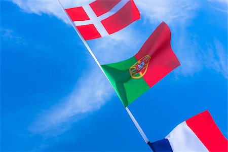 simsearch:700-06752249,k - Danish, Portuguese, and French flags against blue summer sky Stockbilder - Lizenzpflichtiges, Bildnummer: 700-06752263