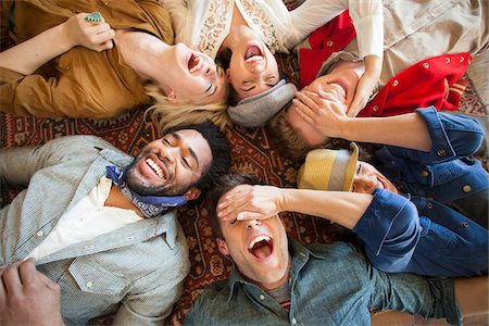 friends smiling together - group of young adults laying down looking up laughing Stock Photo - Rights-Managed, Code: 700-06752637