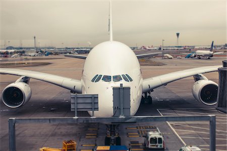 planes in the sky - A double decker A380 pushes back to taxi, Heathrow Airport, London, UK Stock Photo - Rights-Managed, Code: 700-06773196