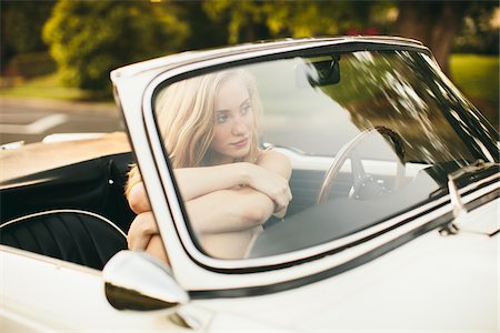 Teenage girl sitting in a 1966 Triumph in Portland Oregon. Stockbilder - Lizenzpflichtiges, Bildnummer: 700-06786693