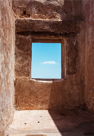 pictures in frames - Blue sky and cloud viewed through stone window in fort Stock Photo - Rights-Managed, Code: 700-06786701