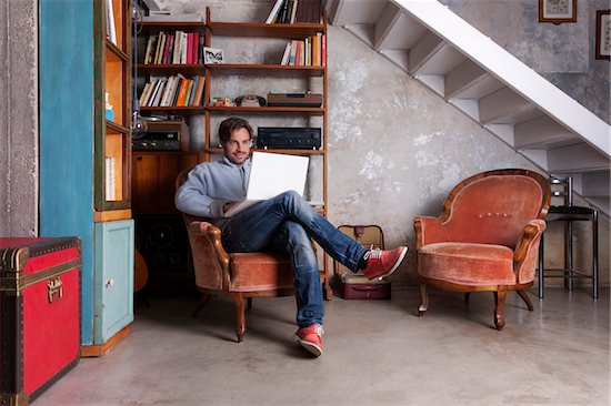 Man working with notebook laptop in home basement Photographie de stock - Premium Droits Gérés, Artiste: Siephoto, Le code de l’image : 700-06782181