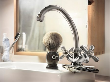 silver - Straight razor and shaving brush on edge of bathroom sink with blood type indicated on shaving brush Stock Photo - Rights-Managed, Code: 700-06808770