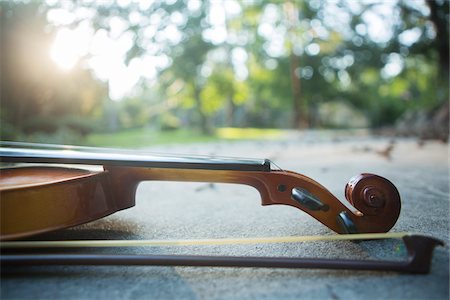 patio lights - Violin outside on concrete Stock Photo - Rights-Managed, Code: 700-06808897