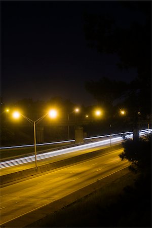 simsearch:700-06786903,k - Long exposure of I-75 Macon, Georgia Interstate with street lights and cars streaking by. Foto de stock - Con derechos protegidos, Código: 700-06808898