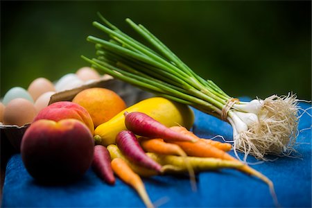 Fresh local organic eggs, fruits, and vegetables from the farmer's market on blue surface Stock Photo - Rights-Managed, Code: 700-06808901