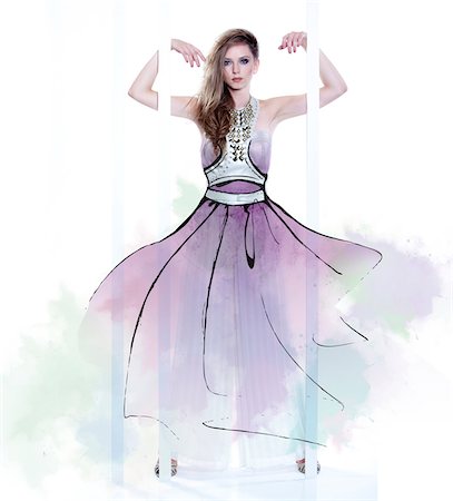 Young Woman Fashion Model Wearing Dress with Illustrated Embellishments Stockbilder - Lizenzpflichtiges, Bildnummer: 700-06826413