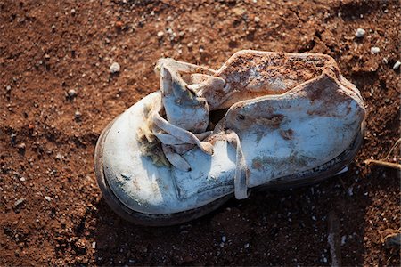 Close-Up of Baby Shoe in Aftermath of Tornado Damage, Moore, Oklahoma, USA. Stock Photo - Rights-Managed, Code: 700-06847405