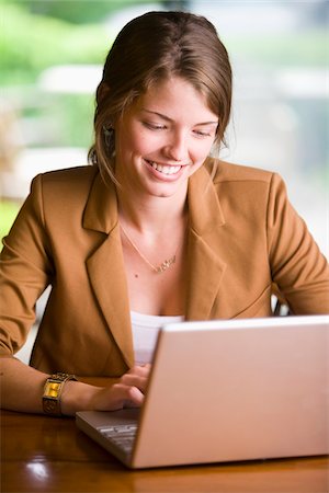 person working on computer at home - Businesswoman using Laptop Computer, Bradford, Ontario, Canada Photographie de stock - Rights-Managed, Code: 700-06847419