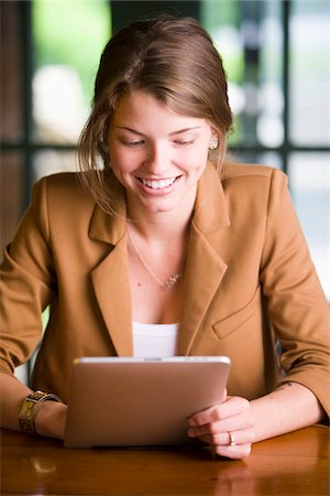 personal computer - Businesswoman using Tablet Computer, Bradford, Ontario, Canada Photographie de stock - Rights-Managed, Code: 700-06847422