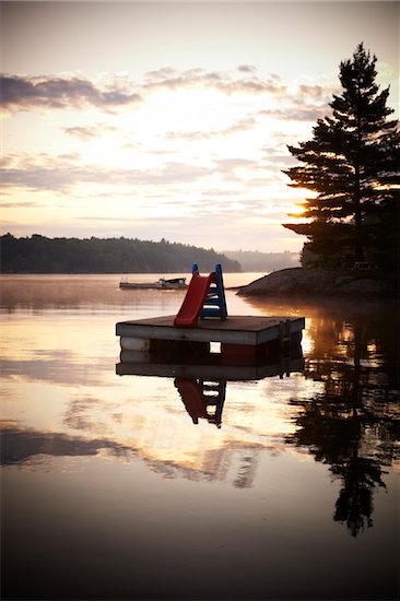 Slide on Floating Dock in Morning, Riley Lake, Muskoka, Northern Ontario, Canada. Stock Photo - Premium Rights-Managed, Artist: Derek Shapton, Image code: 700-06841598