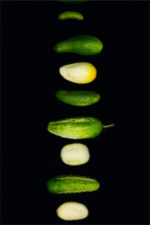 food overhead color background - a variety of fresh local organic artisanal farm-grown cucumbers on black, jeffersonville, georgia Stock Photo - Rights-Managed, Code: 700-06841809