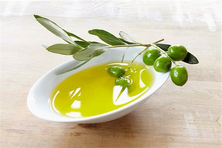 european cuisine - close-up of small bowl with olive oil, olive twig and fresh olives Stock Photo - Rights-Managed, Code: 700-06899812