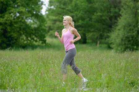 running profile - Blond woman running through field, Germany Stock Photo - Rights-Managed, Code: 700-06899968