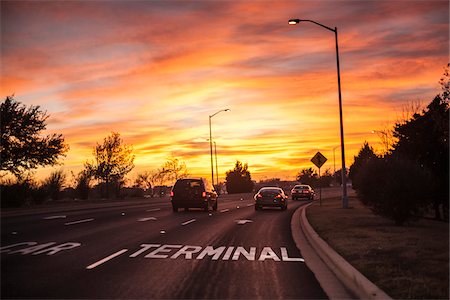 pink sky trees - Sign pointing to airport terminal parking, Austin Bergstrom Airport (AUS), Austin, Texas, USA Stock Photo - Rights-Managed, Code: 700-06892647