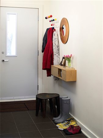 shoes by door - House front entrance way, with jackets, boots and footstool, Ontario, Canada Stock Photo - Rights-Managed, Code: 700-06935035