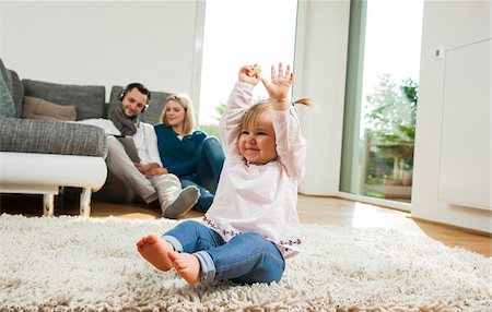 rugs and carpet - Family Relaxing in Living Room, Mannheim, Baden-Wurttemberg, Germany Stock Photo - Rights-Managed, Code: 700-06962015