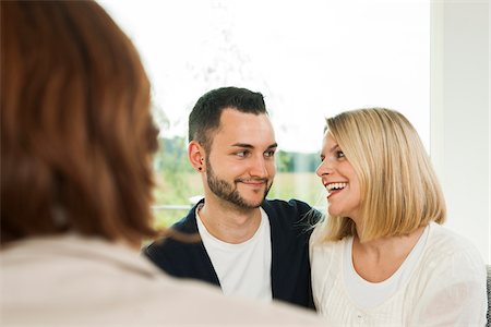 experte - Young Couple Talking to Consultant at Home, Mannheim, Baden-Wurttermberg, Germany Photographie de stock - Rights-Managed, Code: 700-06962044