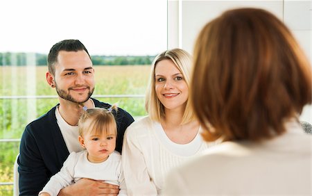 father and daughter talking - Family Talking to Consultant at Home, Mannheim, Baden-Wurttermberg, Germany Foto de stock - Con derechos protegidos, Código: 700-06962046