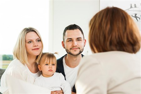 Family Talking to Consultant at Home, Mannheim, Baden-Wurttermberg, Germany Stockbilder - Lizenzpflichtiges, Bildnummer: 700-06962041