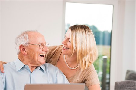 eye wear - Young Woman and Senior Man Laughing at Home, Mannheim, Baden-Wurttemberg, Germany Stock Photo - Rights-Managed, Code: 700-06962185