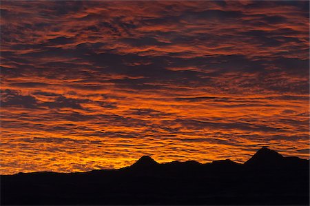 red orange sunset - Huab River Valley area, Damaraland, Kunene Region, Namibia, Africa Stock Photo - Rights-Managed, Code: 700-07067195